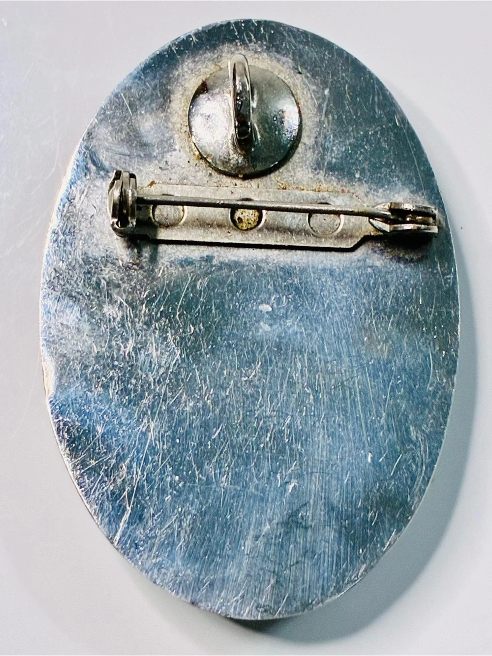 Elevated Simple Black and Silver Oval Brooch with Mother-of-Pearl Center Pendant